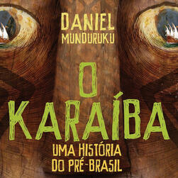 Recorte da capa de O Karaíba, em que o título aparece em verde no centro e, atrás, a ilustração de um grande rosto